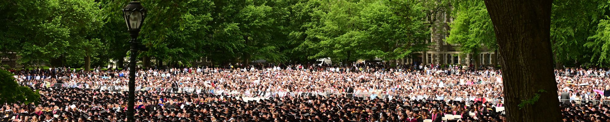 Wide shot of graduates and their families at Fordham University Commencement 2024