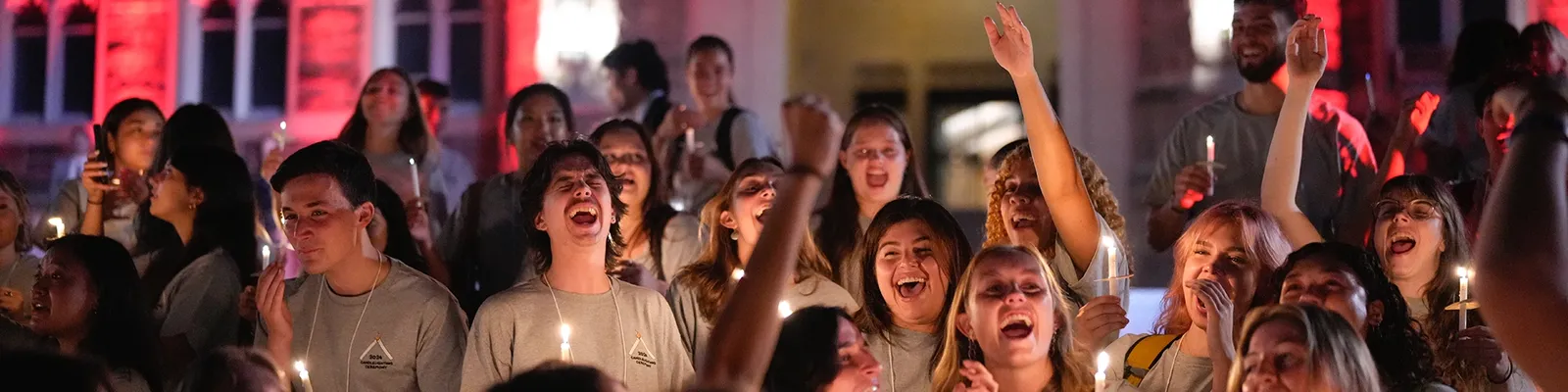 Students lighting candles for orientation