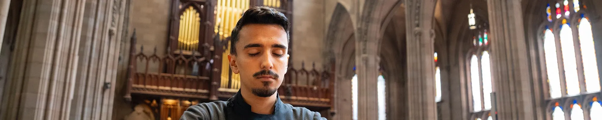 John Garza prepares for daily Mass at NYC's iconic Trinity Church.