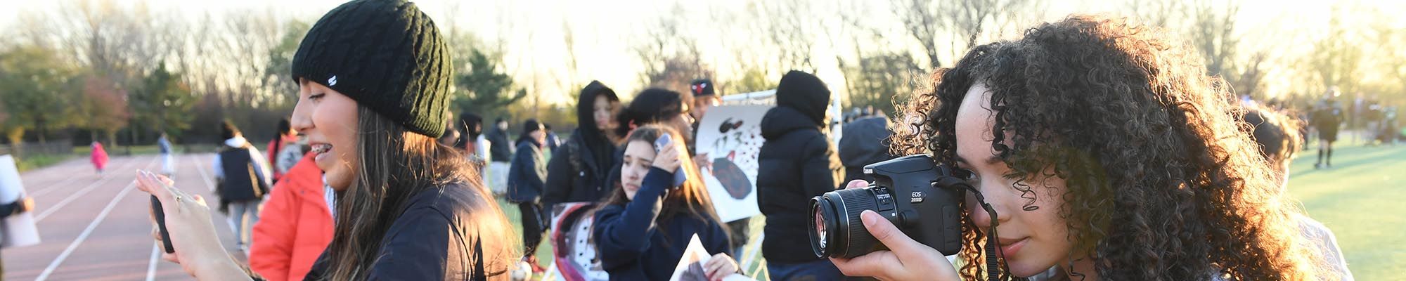 Student interns with camera