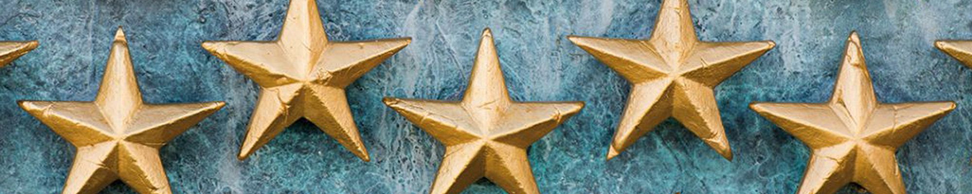 Star emblems against a blue wall