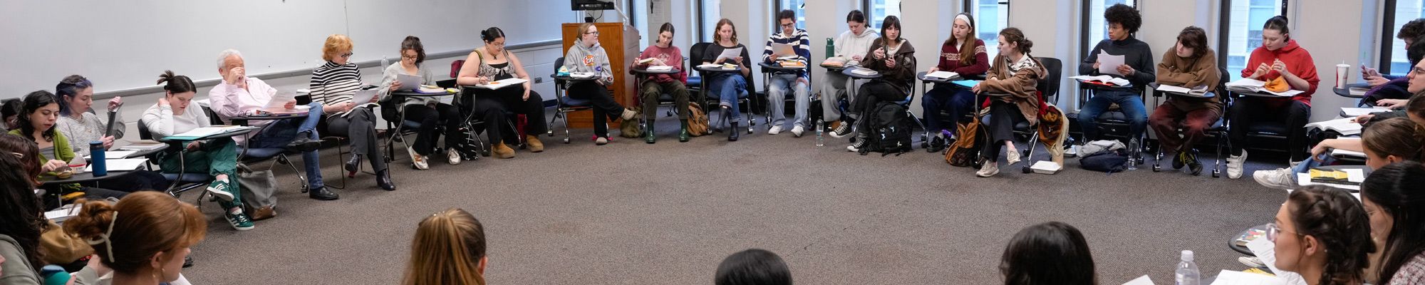 Students sit in a circle in a classroom for a discussion