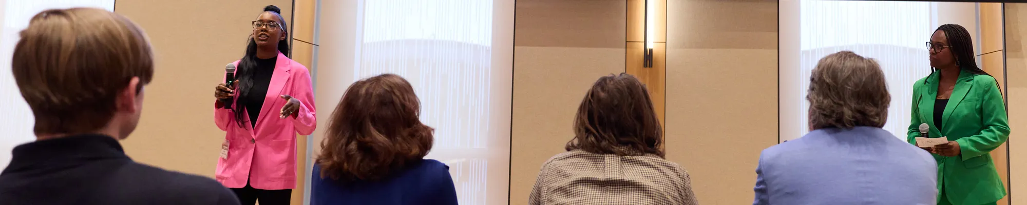 Two female students deliver their business plan presentation at a Fordham Foundry event