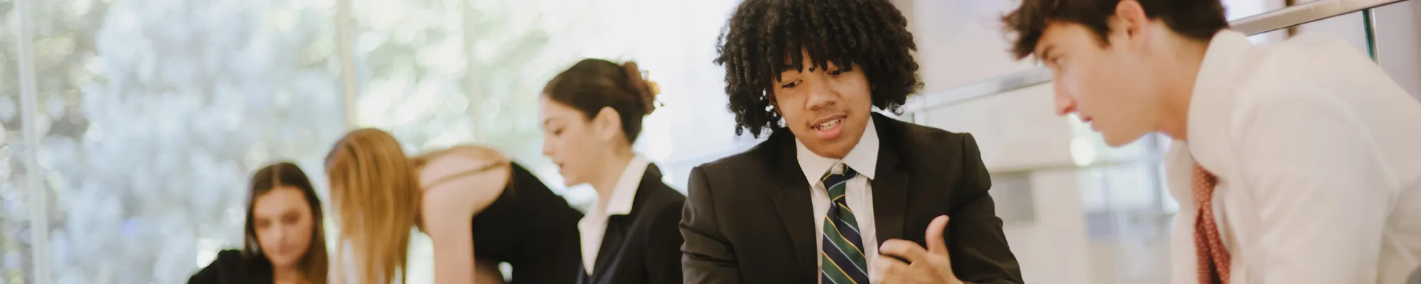 Student sitting together in discussion during a group project