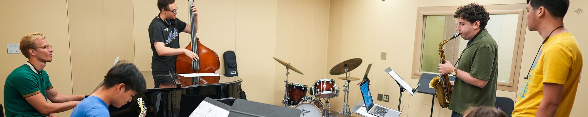 Ensemble of musician performing in a studio space