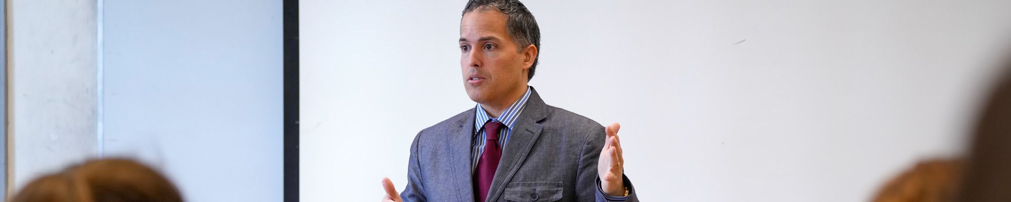 Professor Henry Borrero speaks to a class