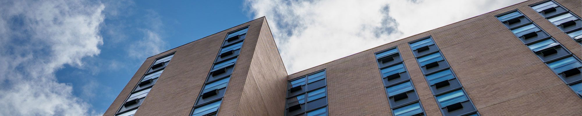Upward view of the facade of Walsh Hall