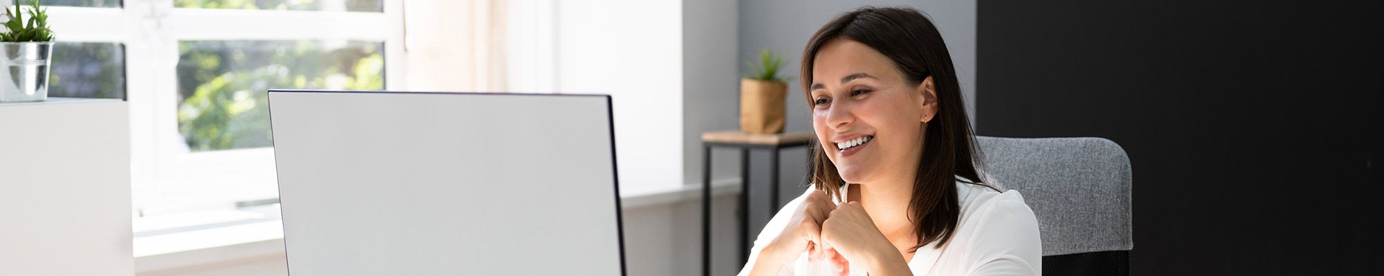 Graduate Online Management Student Taking a Class