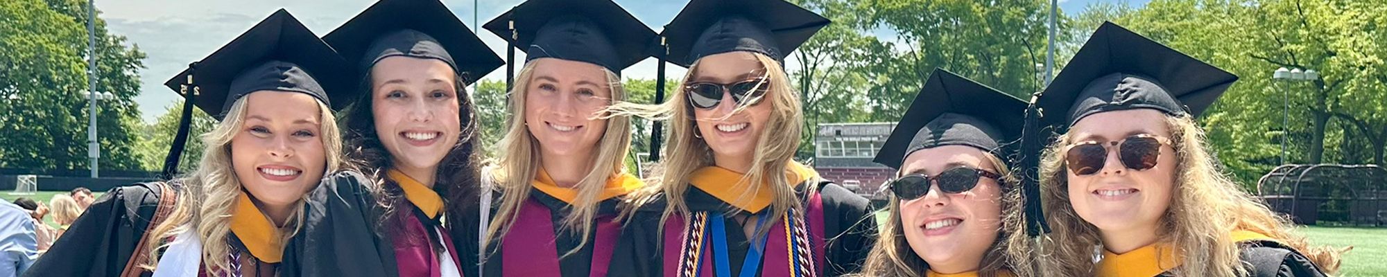 Smiling Graduates at Undergraduate Diploma Ceremony