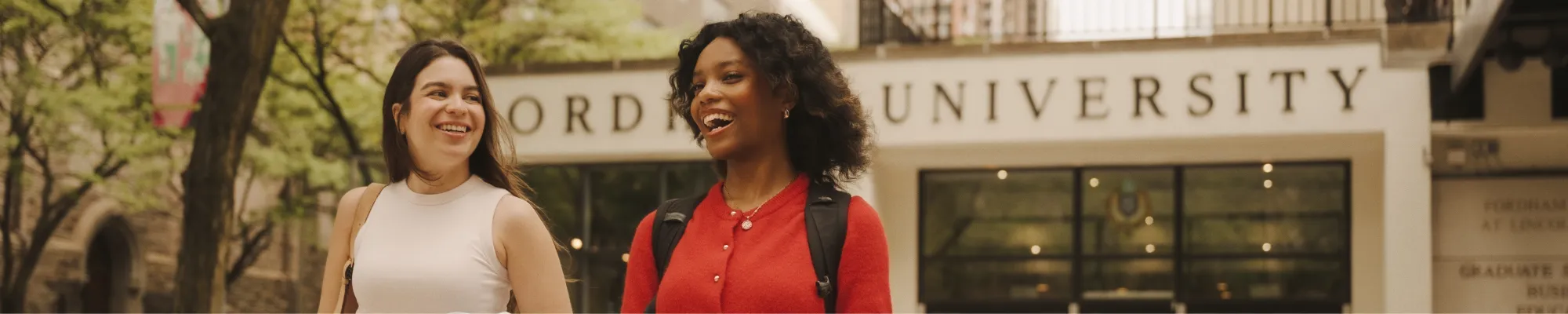 two Fordham MSW students walk outside Fordham's Lincoln Center cmapus.