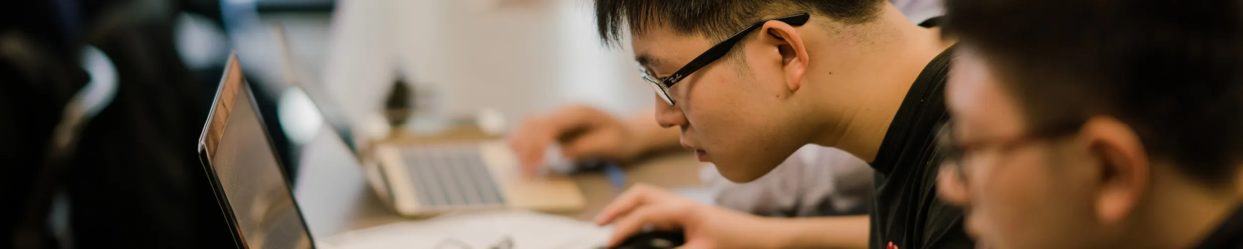 Image of a student working on a laptop