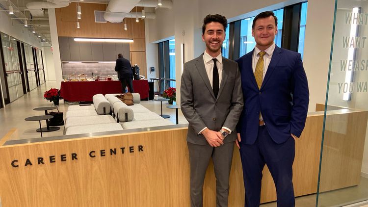 Two students dressed professionally at the Career Center