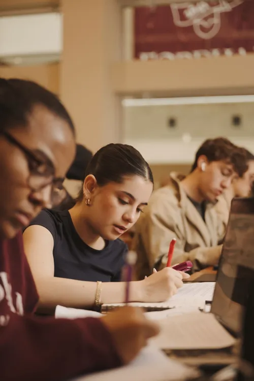 Students taking notes in class