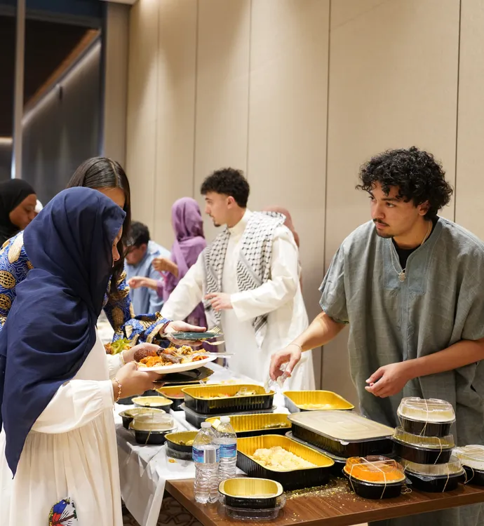 Students serve eat other food.