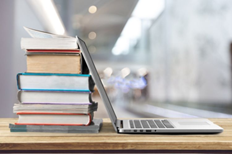 Laptop with books