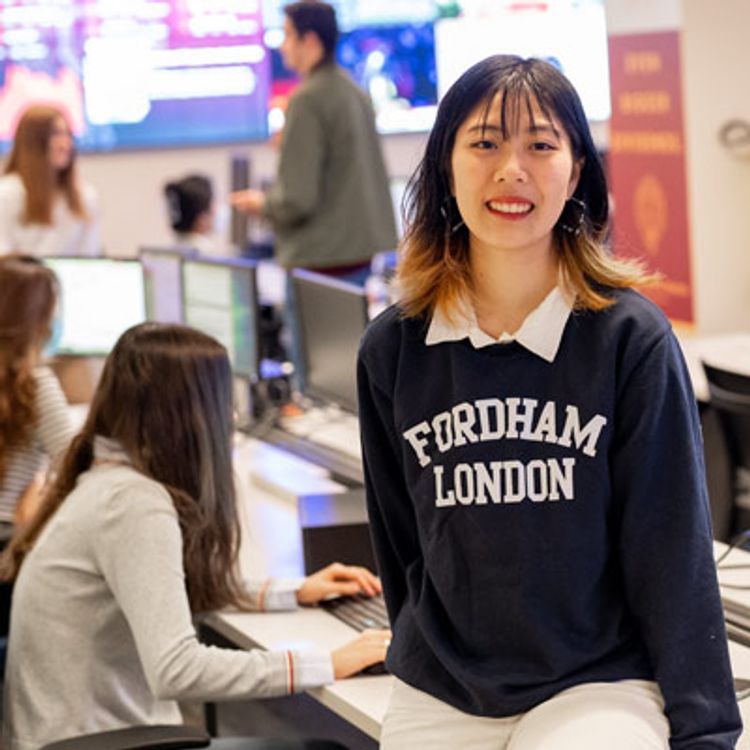 Student with Fordham London Sweatshirt