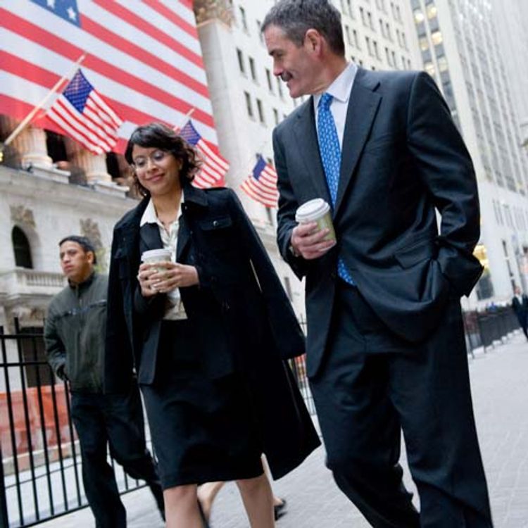 Photo od lawyers in suits walking on Wall Street