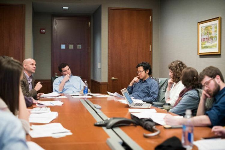 Philosophy faculty in a workshop.