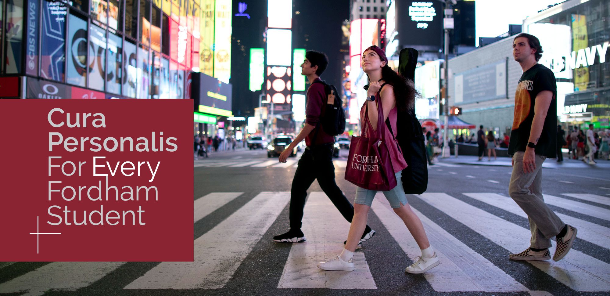 Cura Personalis | For Every Fordham Student campaign logo with image of Fordham students in Times Square