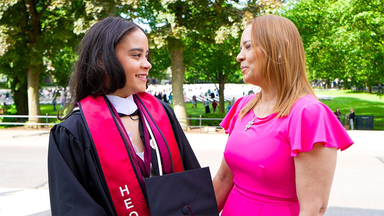 Emely Sosa, a first-generation graduate, with her mother at Fordham’s 2024 Commencement. Photo by Taylor Ha