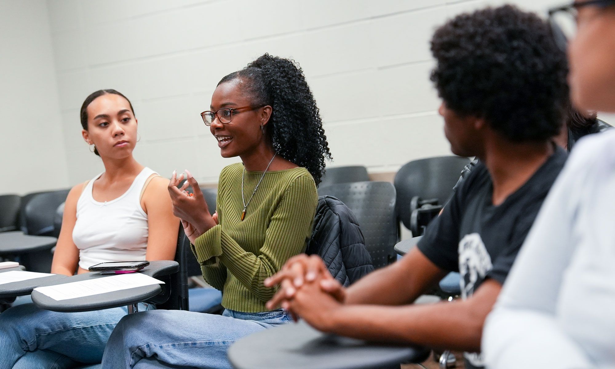 Students sit in a club meeting