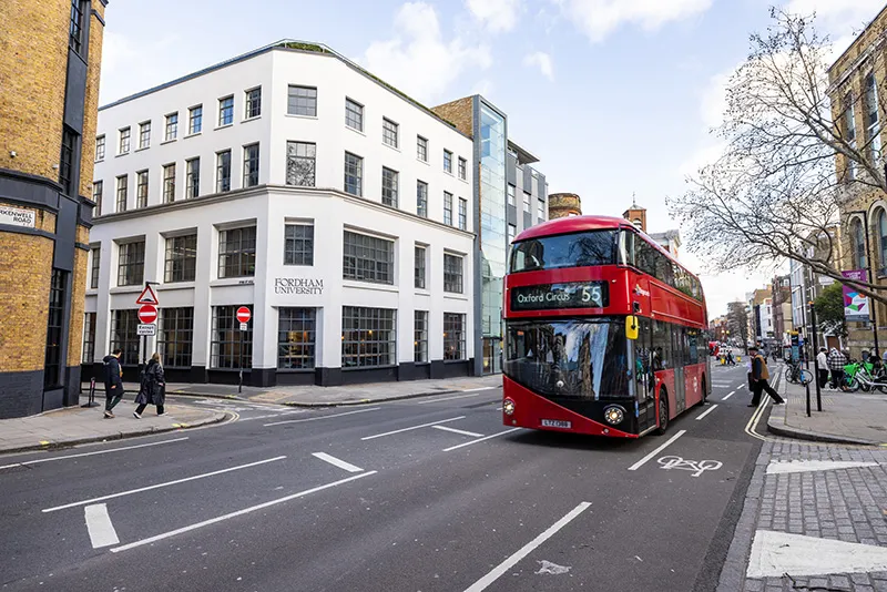 Fordham London with double-decker bus passing in the street