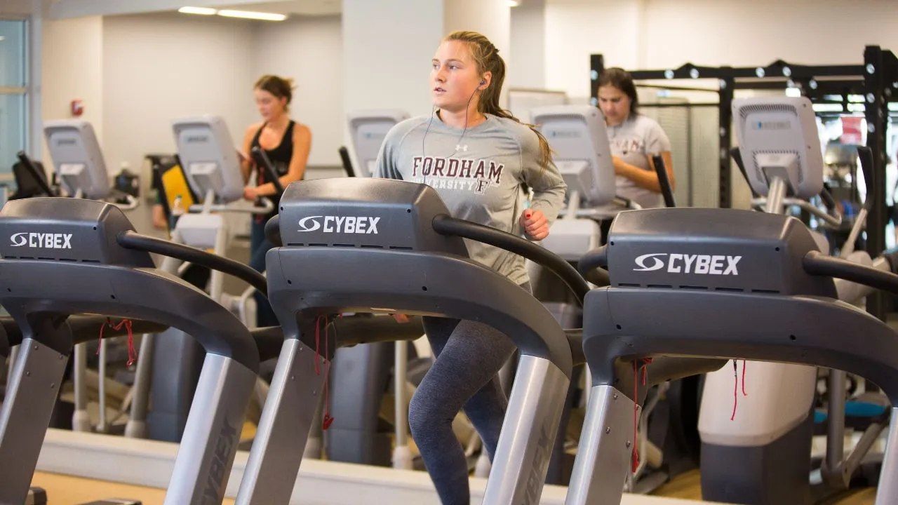 Students run on treadmills in Fordham's RamFIt Center