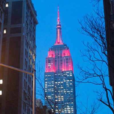 Empire State Building lit up in maroon