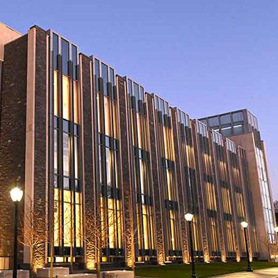 New campus center lit up in the evening.