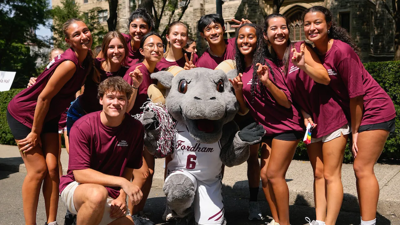 Students standing with Ramses on Rose Hill campus