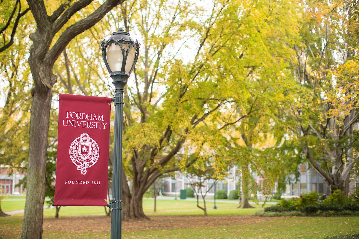 Fordham banner on a lightpole on the Rose Hill Campus