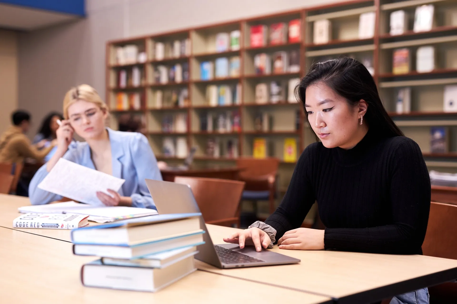 Students studying in library