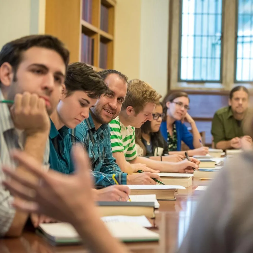 Graduate students participate in a seminar on the Rose Hill campus