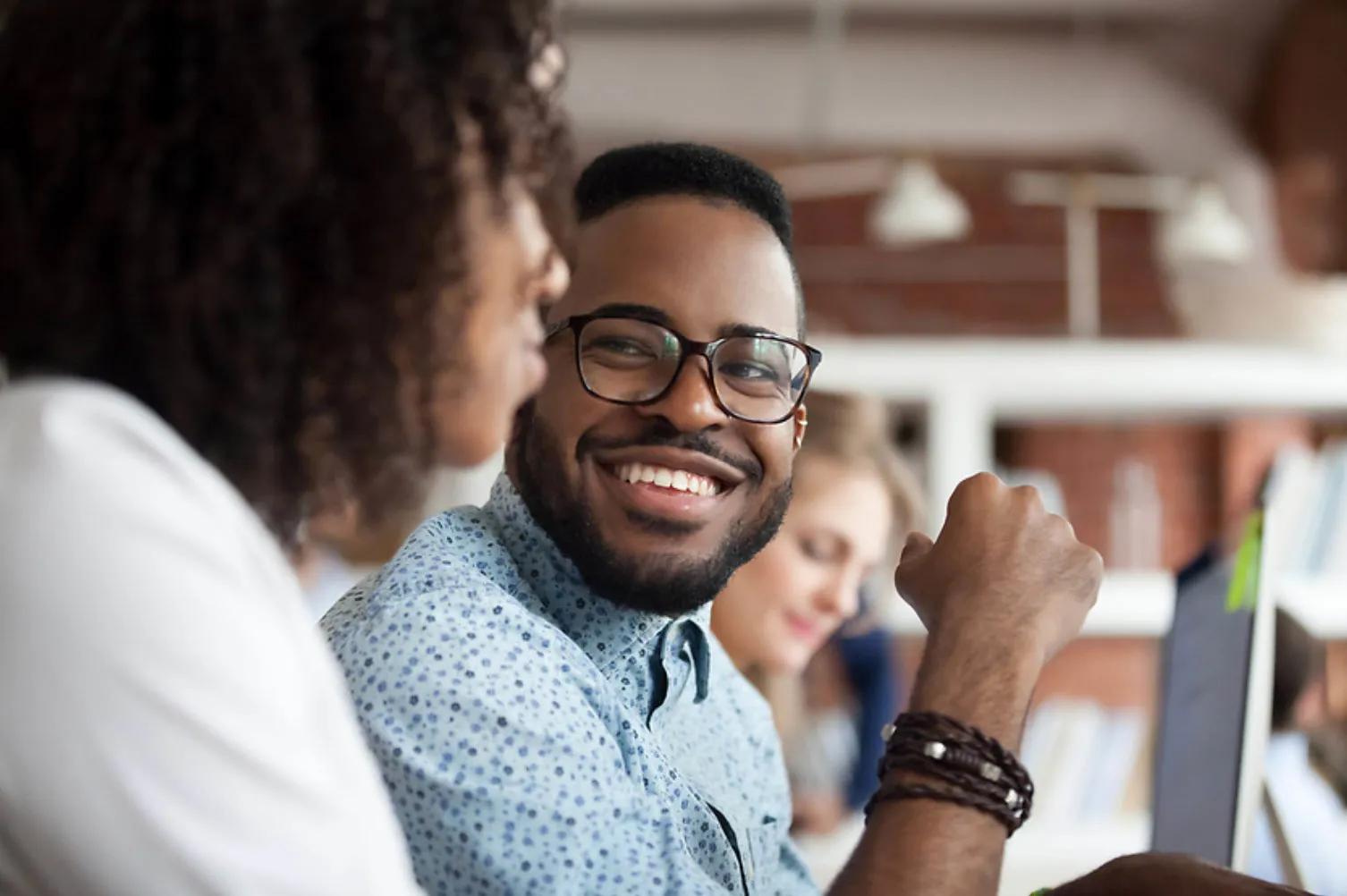 Two people talking in an office