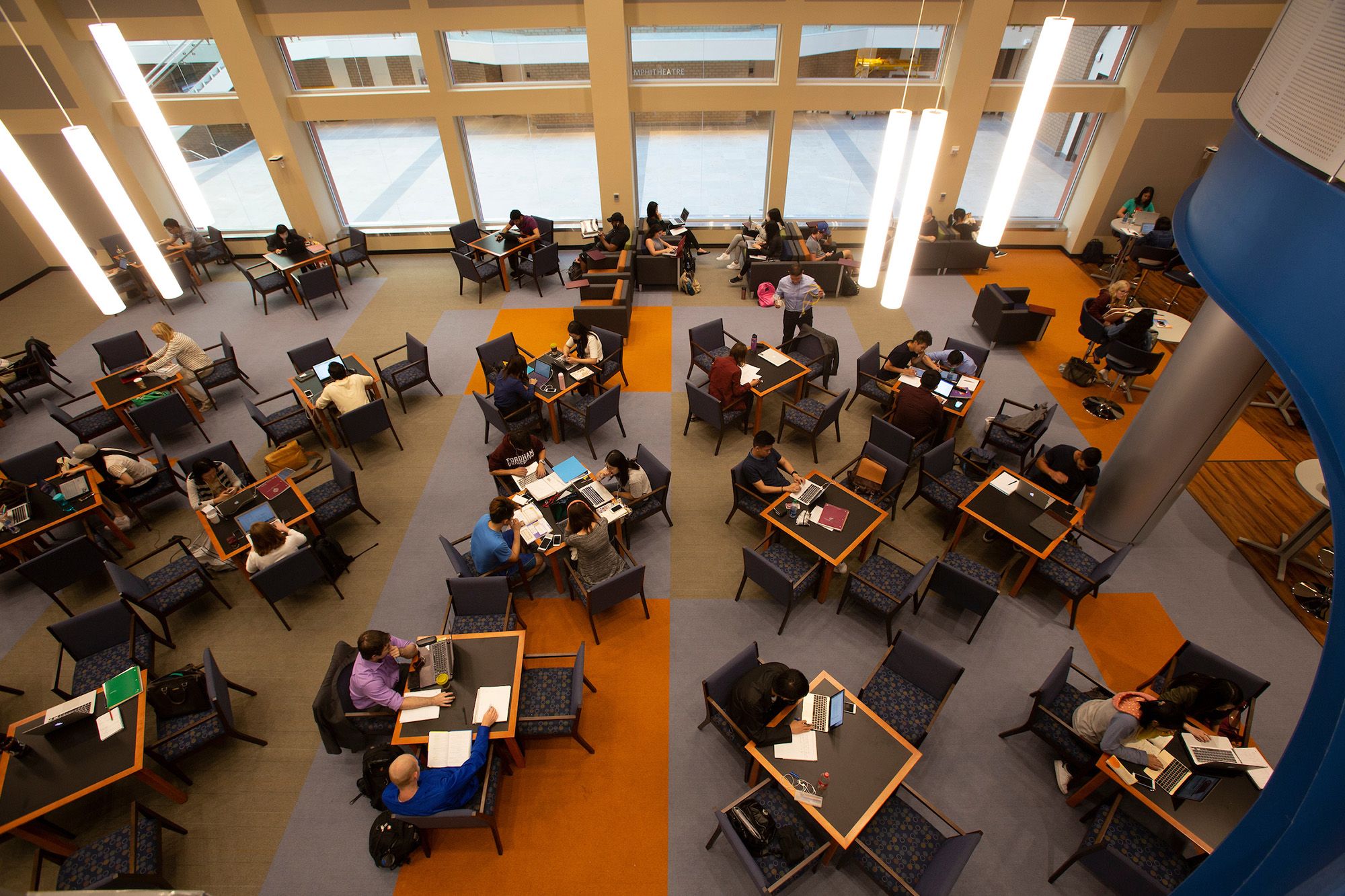 Picture of students at tables in Library