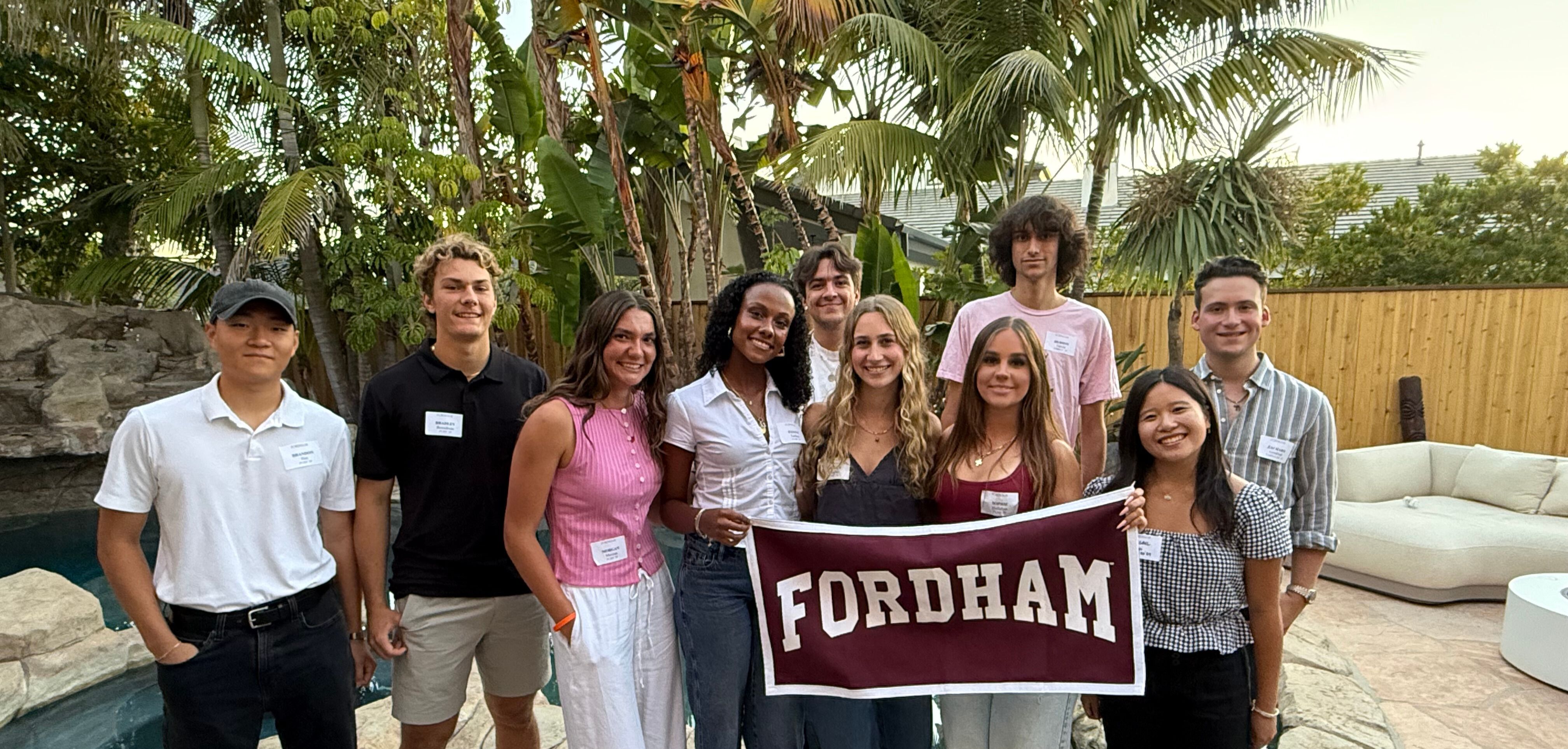 Students in Orange County posing with Fordham banner
