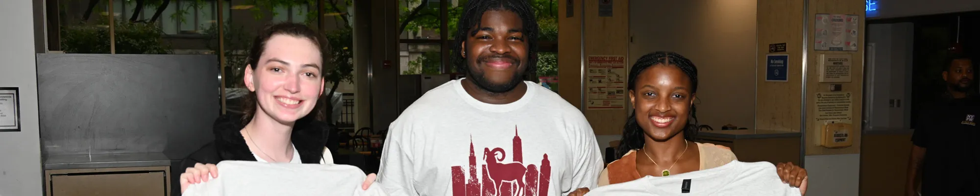 Three students sporting LC senior week shirts in May 2025
