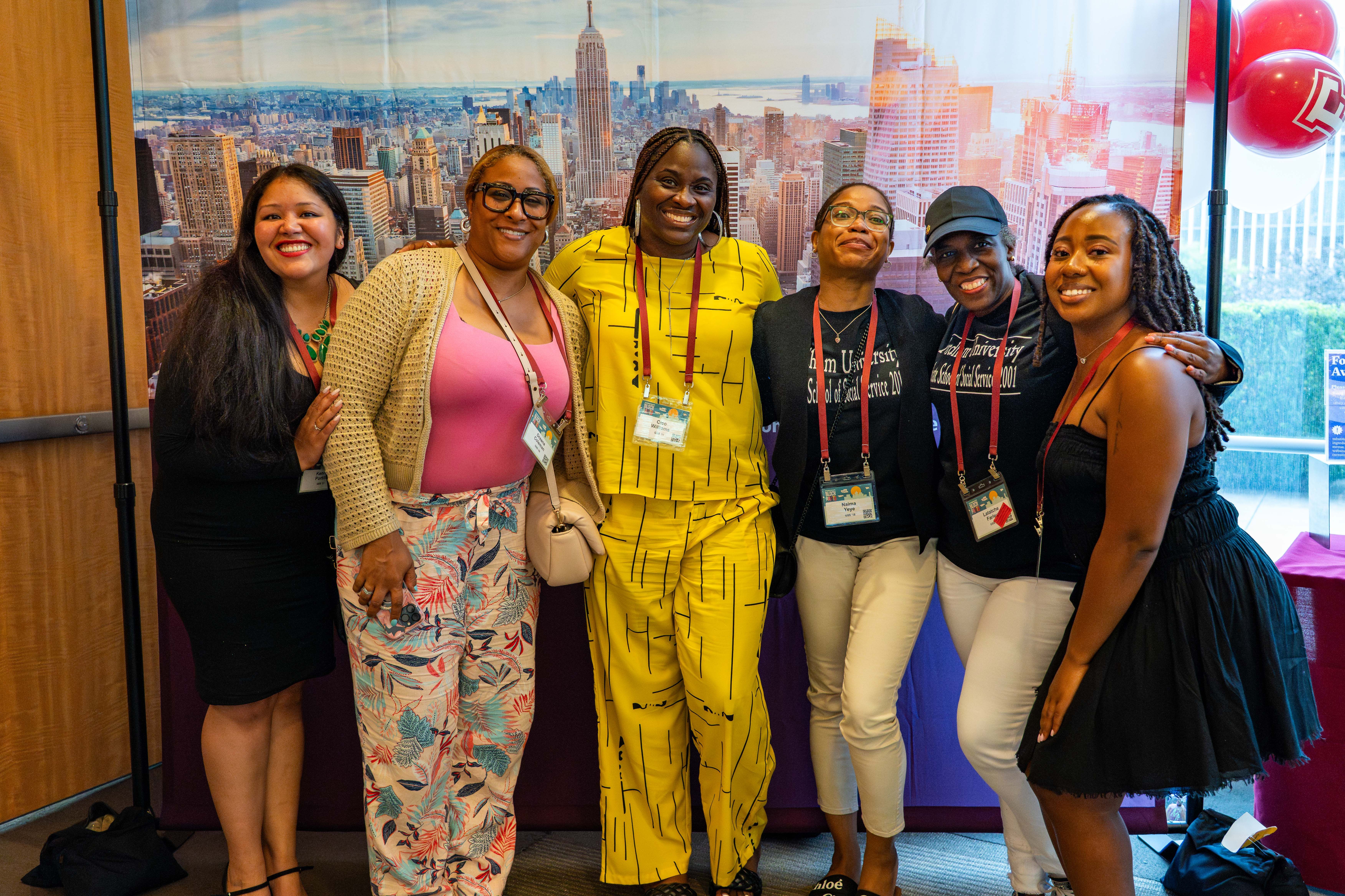 A group of Fordham GSS alumni pose for a photo at the GSS 2025 Block Party.