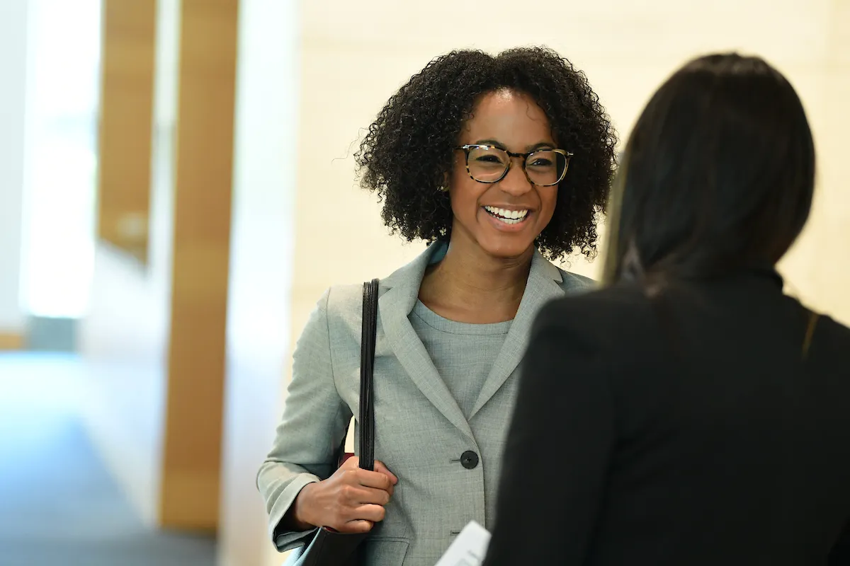 Femal student in business suit talking